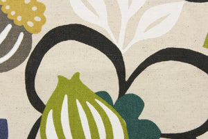  This cotton blend fabric features a large floral design in the colors of white, black, brown, blue and green set against a beige background. 