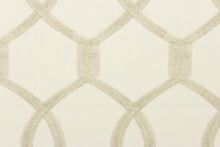 Load image into Gallery viewer, This fabric features interlocking ovals in khaki on a off white background. 
