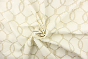 This fabric features interlocking ovals in khaki on a off white background. 