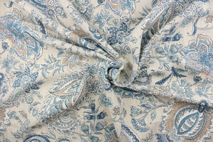 This fabric features a paisley and floral print on a light sand slubbed ground.  Colors included are blue, gray, tan, cream and metallic silver. 