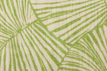 Load image into Gallery viewer, This pattern features large tropical leaves in lime green on a natural linen background. 
