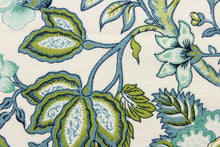 Load image into Gallery viewer,  This printed decorative fabric features a beautiful floral design and foliage in shades of blue, teal and green on a white background.
