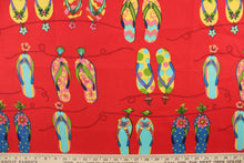 Load image into Gallery viewer, This outdoor fabric features brightly colored flipflops in yellow, pink, green, blue, and turquoise against red background. 
