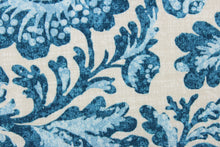 Load image into Gallery viewer, This outdoor fabric has a floral and bird design in varying shades of blue against a pale gray background. 
