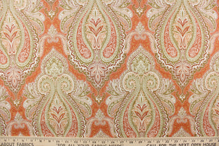 : This fabric features an damask design in varying shades of orange, taupe, white, and khaki