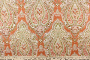 : This fabric features an damask design in varying shades of orange, taupe, white, and khaki