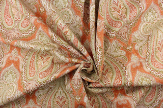 : This fabric features an damask design in varying shades of orange, taupe, white, and khaki