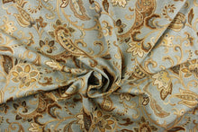Load image into Gallery viewer, This linen rayon blend fabric features a paisley design in brown, khaki, blue, cream and hints of gold against a light blue gray background.
