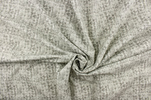 This fabric has a unique design in varying shades of gray and white. This fabric has a distress look to it. 