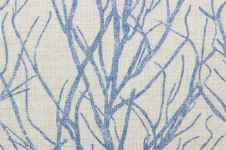 This fabric features a branch design in blue against a pale gray background.