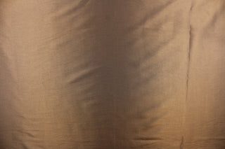 This taffeta fabric in a iridescent dark khaki. 