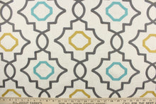 Load image into Gallery viewer, This fabric features an embossed geometric design in gray, turquoise and gold on a  natural colored background.  
