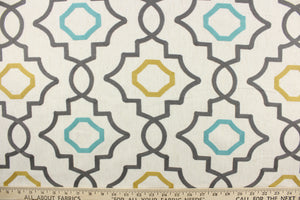 This fabric features an embossed geometric design in gray, turquoise and gold on a  natural colored background.  