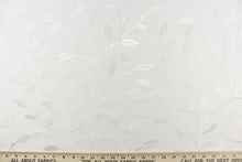 Load image into Gallery viewer,  This luxurious duotone fabric features embroidered leaves on a silky white background.
