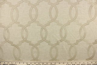  This fabric features a modern geometric design artfully embroidered in champagne gold on a linen colored background. 