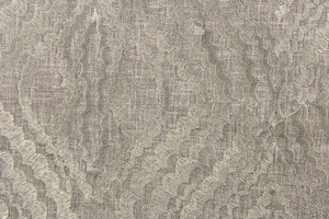 This fabric features a unique design in pewter and has a shimmer that enhances the design.