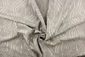 This fabric features a unique design in pewter and has a shimmer that enhances the design.