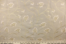 Load image into Gallery viewer, This fabric features a beautiful embossed floral design in rose gold on a dark beige background. 
