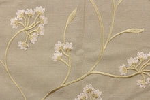 Load image into Gallery viewer, This fabric features a beautiful embossed floral design in rose gold on a dark beige background. 
