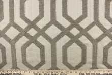 Load image into Gallery viewer, This fabric features a modern geometric design artfully embroidered with rope yarns in pewter on a natural colored background.
