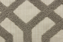 Load image into Gallery viewer, This fabric features a modern geometric design artfully embroidered with rope yarns in pewter on a natural colored background.
