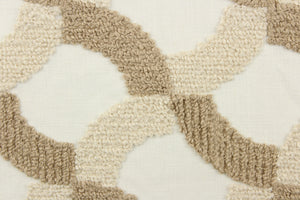This fabric features an embossed lattice design in light brown and beige  on a white background.