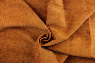 This hard wearing, textured chenille fabric in apricot would be a beautiful accent to your home decor