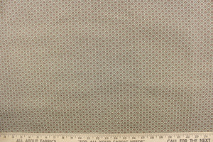 This jacquard features a diamond design in brown and green on a light beige background.  It is clean and crisp and would work well for draperies, curtains, cornice boards, pillows, cushions, bedding, headboards and furniture upholstery.  It is stain- resistant and durable with a rating of 15,000 double rubs.