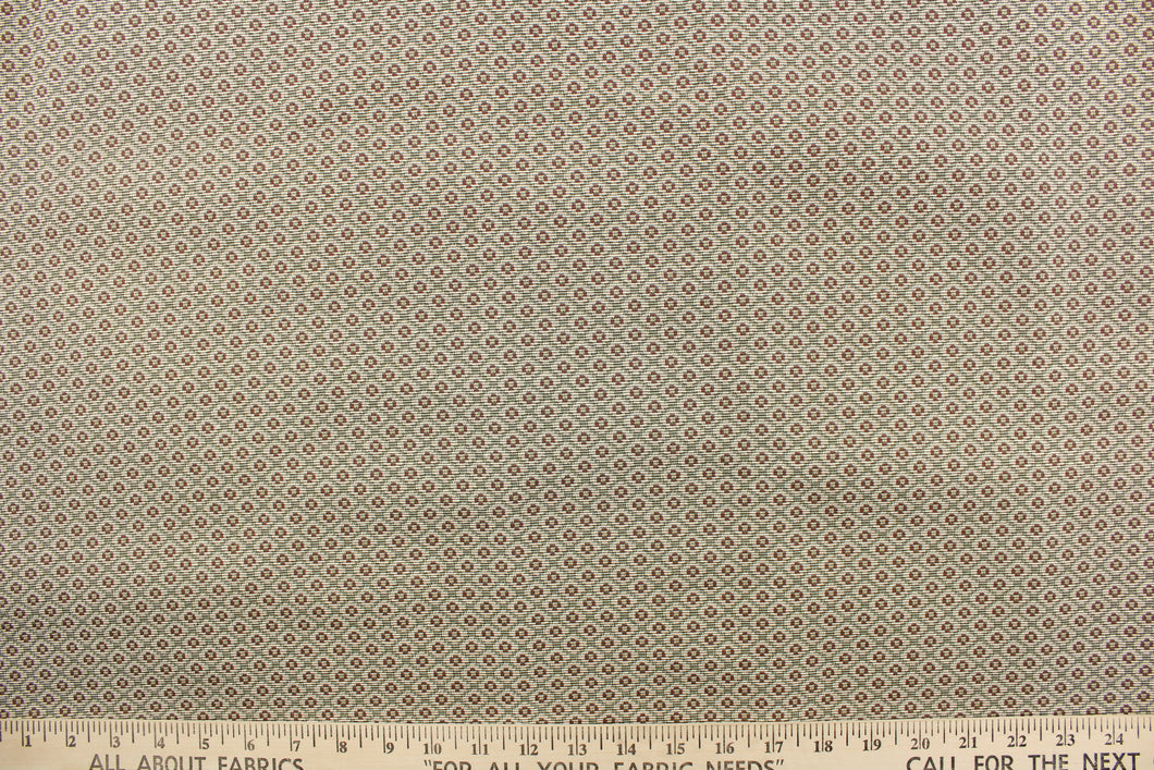 This jacquard features a diamond design in brown and green on a light beige background.  It is clean and crisp and would work well for draperies, curtains, cornice boards, pillows, cushions, bedding, headboards and furniture upholstery.  It is stain- resistant and durable with a rating of 15,000 double rubs.