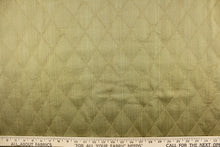 Load image into Gallery viewer, This quilted fabric design in olive green is durable and hard wearing and would be great for multi-purpose upholstery, bedding, cornice boards, accent pillows and drapery.  The possibilities are endless.
