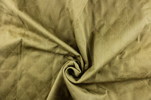 Load image into Gallery viewer, This quilted fabric design in olive green is durable and hard wearing and would be great for multi-purpose upholstery, bedding, cornice boards, accent pillows and drapery.  The possibilities are endless.
