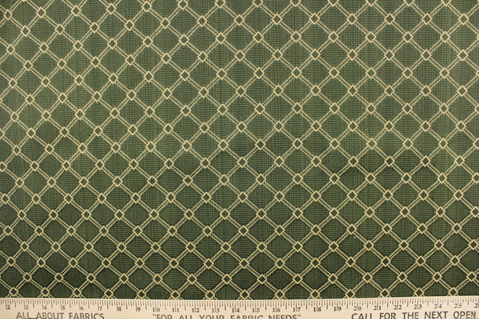 This jacquard features a geometric design in beige on a jade background.   It is clean and crisp and would work well for draperies, curtains, cornice boards, pillows, cushions, bedding, headboards and furniture upholstery.  It is stain- resistant and durable with a rating of 15,000 double rubs.
