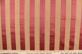 This stunning yarn dyed fabric features a striped pattern in crimson and coral.  Enhancing the colors of the stripes is a slight sheen.  This fabric would enrich any room whether you use it for drapery or an accent chair.  It is also perfect for throw pillows, home décor, duvet covers and apparel.  The possibilities are endless. 