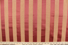 Load image into Gallery viewer, This stunning yarn dyed fabric features a striped pattern in crimson and coral.  Enhancing the colors of the stripes is a slight sheen.  This fabric would enrich any room whether you use it for drapery or an accent chair.  It is also perfect for throw pillows, home décor, duvet covers and apparel.  The possibilities are endless. 
