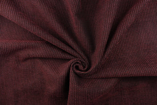 This duotone hard wearing, textured chenille fabric in burgundy with black accents would be a beautiful accent to your home decor.