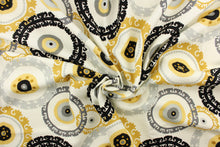 Load image into Gallery viewer,  This fabric features a multi decorative circle design in gold, gray, and black against a white background 
