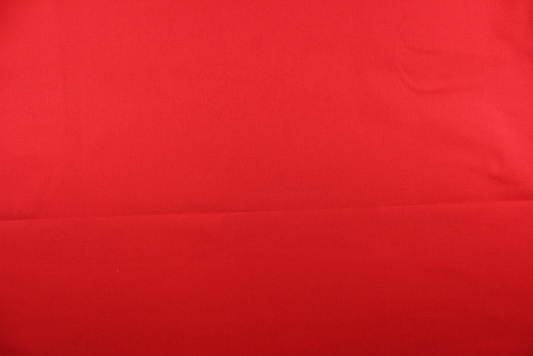 Twill fabric in a solid red .