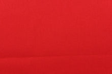 Load image into Gallery viewer, Twill fabric in a solid red .
