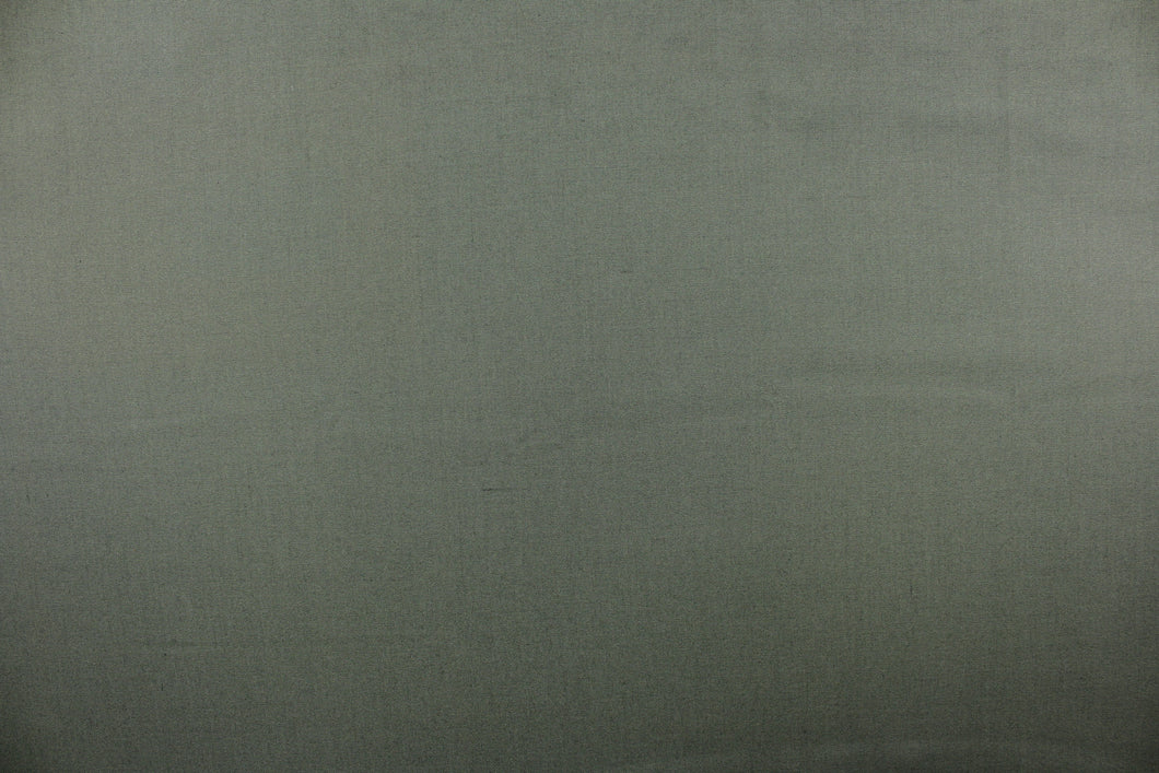  Poplin fabric in a solid greenish gray.