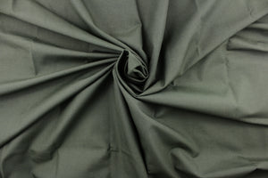  Poplin fabric in a solid greenish gray.