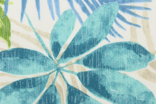  This outdoor fabric features a floral design in blue, teal, green, and light khaki against white. 