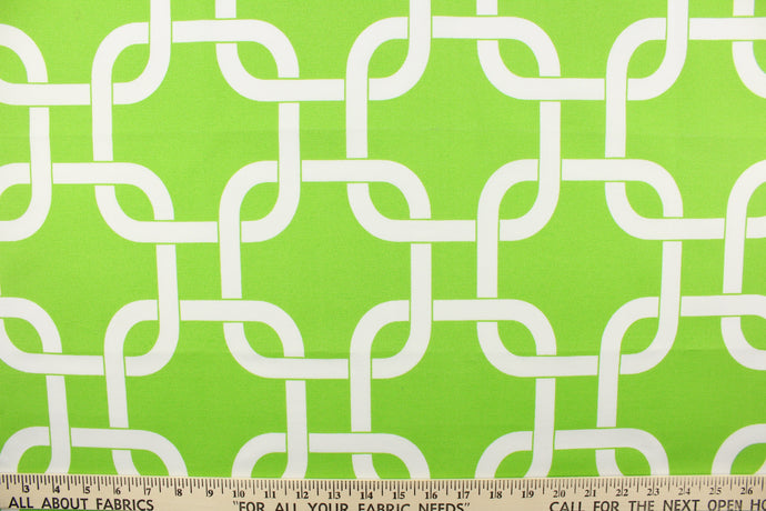 This outdoor fabric features a chain link design in white against a bright green .
