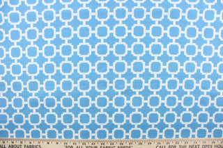 : This outdoor fabric features a geometric design in white against a blue background. 