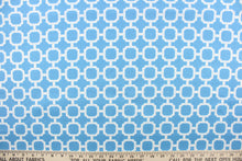 Load image into Gallery viewer, : This outdoor fabric features a geometric design in white against a blue background. 
