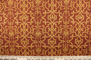 This outdoor fabric features an enteric design in golden brown against a rust red .