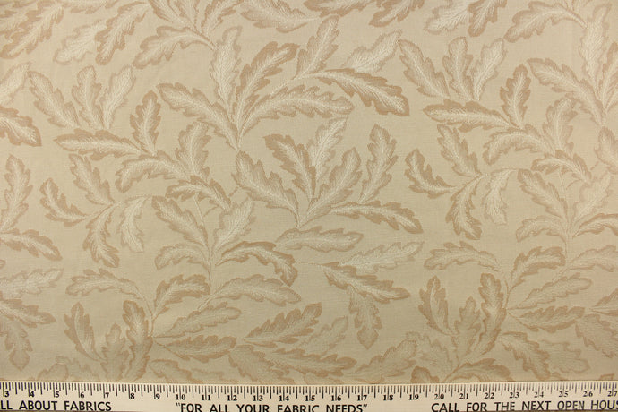 This elegant jacquard features a leaf design in tones of cream and beige. It is clean and crisp and would work well for draperies, curtains, cornice boards, pillows, cushions, bedding, headboards and furniture upholstery.  It is stain- resistant and durable with a rating of 15,000 double rubs.