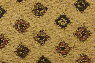 This hard wearing, textured chenille fabric features diamond shapes in green, red, and brown on a desert sand colored background.