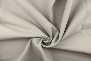 Twill fabric in a solid light gray with brownish undertones .