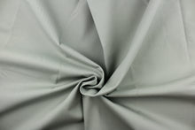 Load image into Gallery viewer, Twill fabric in a solid gray with greenish undertones .

