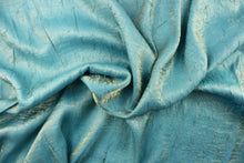 Load image into Gallery viewer, Taffeta fabric features a crinkle in iridescent blue and gold.

